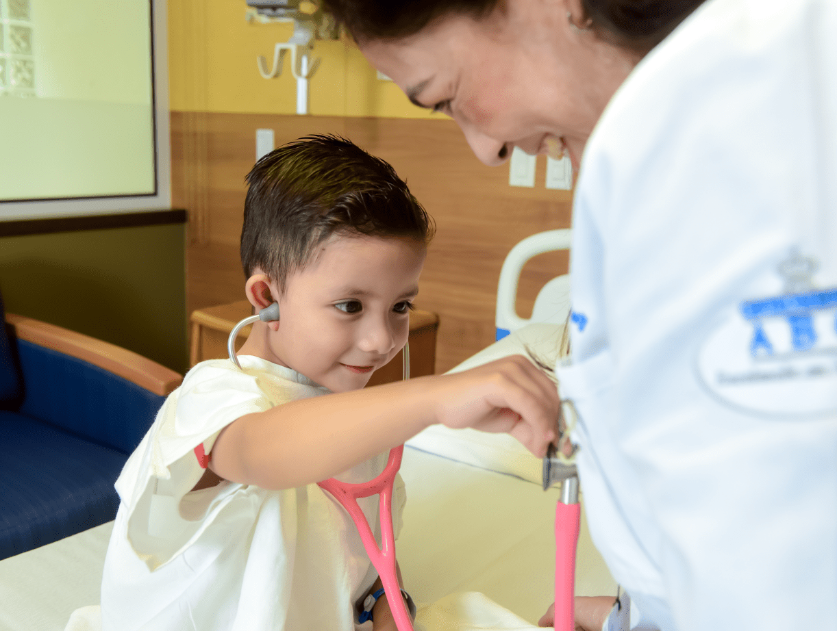 Pediatric cardiologist caring for a child at ABC Medical Center
