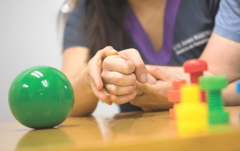 Two hands doing rehabilitation therapy